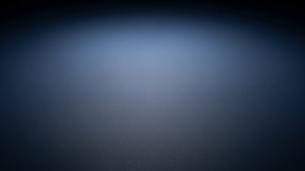 A dark blue background with a light in the center photo