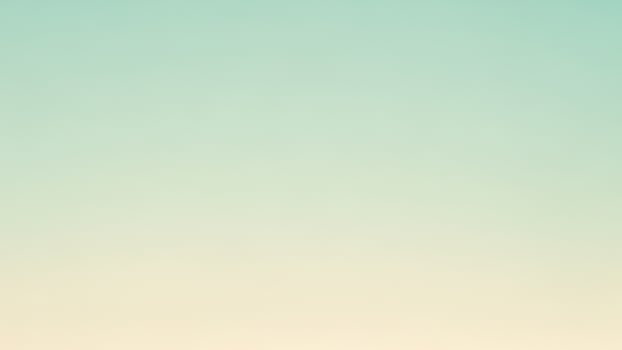 A person standing on a beach with a blue sky photo
