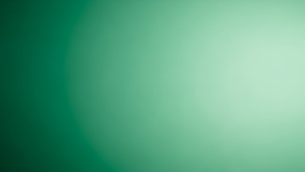 A green light is shining on a wall photo