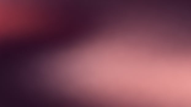 A blurry image of a red and pink background photo