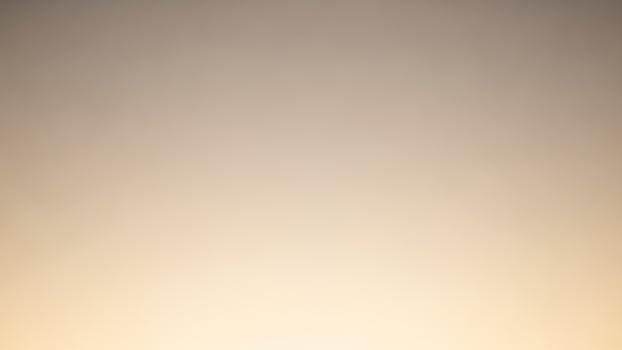 A blurry image of a sunset with a light in the sky photo