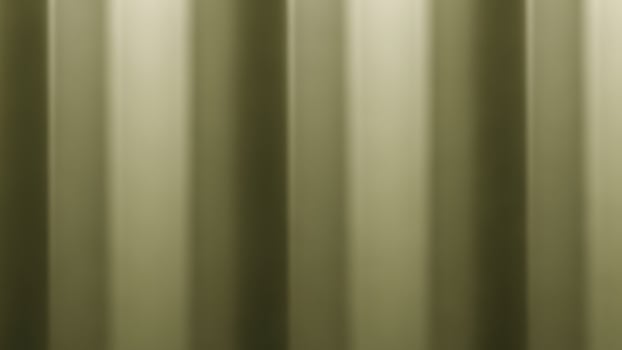 A close up of a green curtain with vertical stripes photo