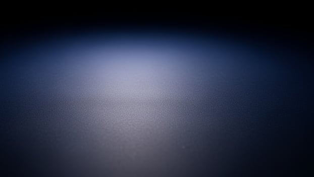 background. dark blue background with a light shining on it background. photo