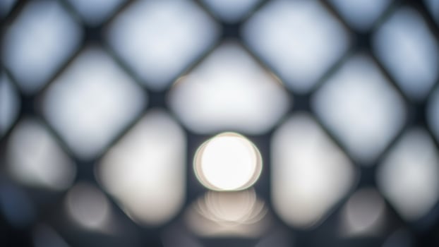 Abstract background of a light in a cage photo