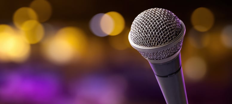 The microphone capturing the essence of live performance with dynamic bokeh background. photo