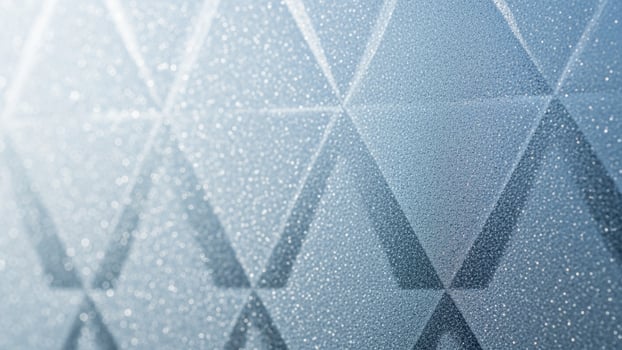 A blue background with a triangle pattern photo