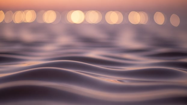 A blurry photo of waves on the ocean