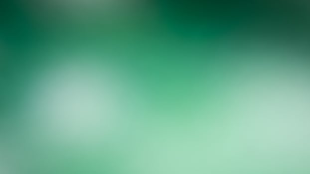 A blurry green background with a blurred image photo