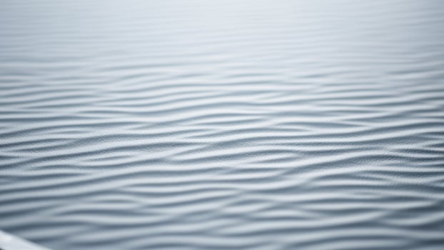 A close up of a wavy surface of sand photo