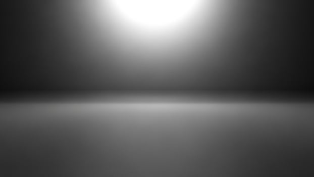 Black and white photo of a bright light shining in the dark