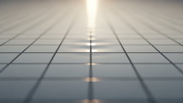 A long line of light shining through a grid of squares photo