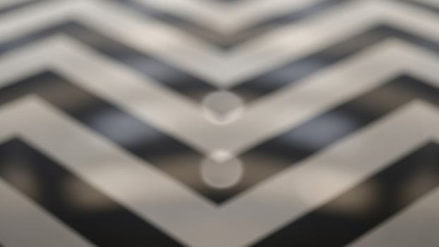 A black and white chevron pattern on a floor photo