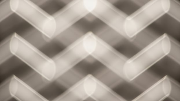 A photo of a metal mesh background with a chevron pattern