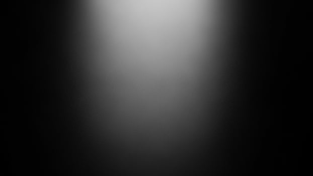A black and white photo of a light beam