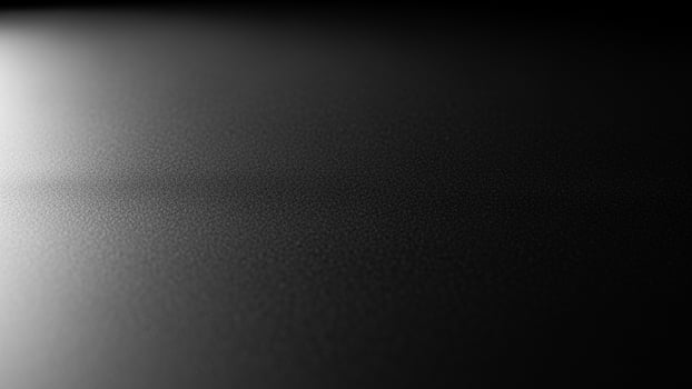 Black and white abstract background with light shining through photo