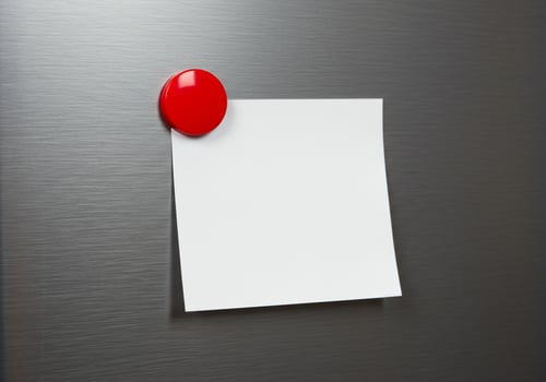 Blank note paper on metal surface with red magnet notice bulletin photo