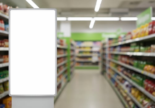 Blank retail sign inside supermarket aisle with copy space for advertisement and promotion photo