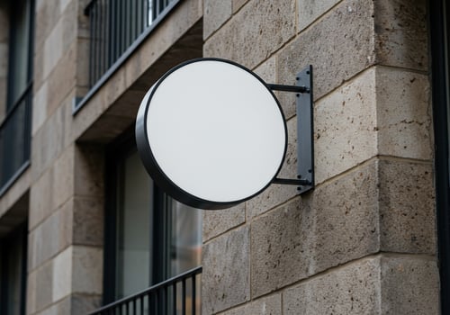 Blank round signage on building exterior ready for custom text photo