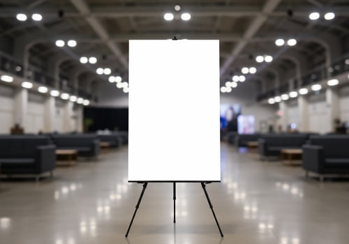 Blank white board on easel stand for presentation advertising sign mockup photo
