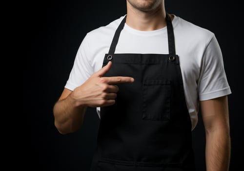 Person in apron presenting item professional uniform and work attire isolated photo