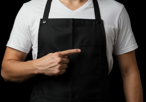 Person in apron pointing direction or recommending choice photo