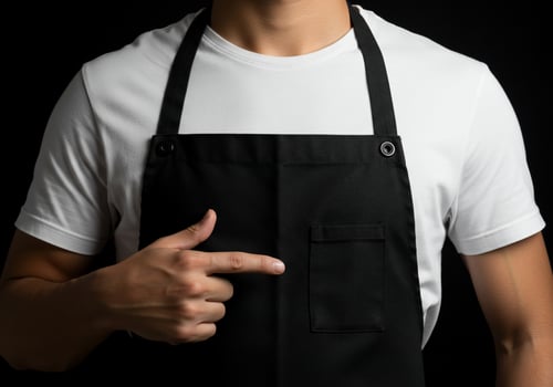 Person wearing apron pointing to blank space advertisement photo