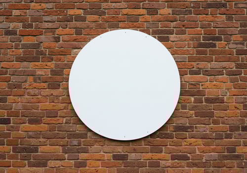 Round white sign on brick wall background texture for mockups and designs photo