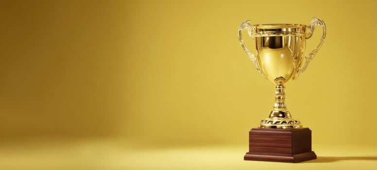 The shining gold trophy symbolizing victory and achievement on a vibrant background. photo