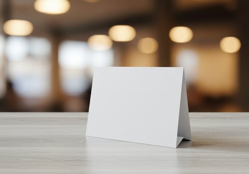 White card on light surface mockup for message display photo
