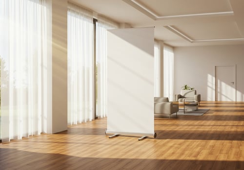 Blank banner stand in bright modern room interior mockup photo