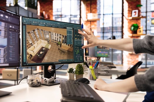 Freelancer designs a home interior using architectural software on her PC, program provides a detailed catalog of furniture and flooring options. Professional 3D rendering and virtual set design. photo