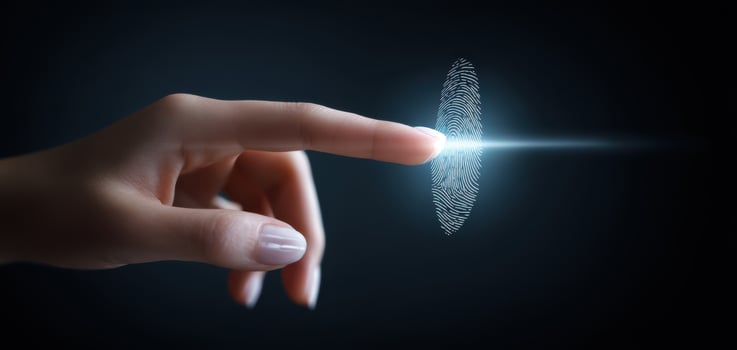 The hand reaching for a digital fingerprint symbolizing security and innovation. photo