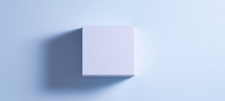 The blank square box on a soft blue background with subtle shadows. photo