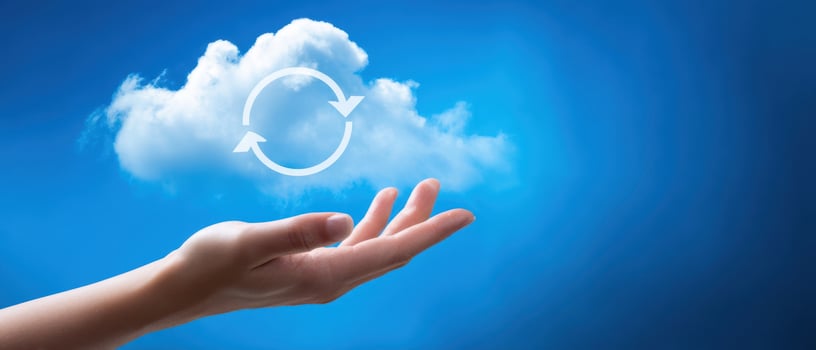 The hand holding a cloud symbolizing cyclical energy and sustainability. photo