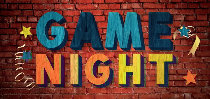 The vibrant Game Night celebration on a textured brick wall. photo