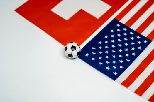 National Flags of Switzerland and USA at Football Match photo