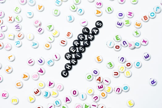 Colorful Alphabet Beads Spelling Merry Christmas photo