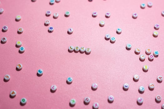 Conceptual beautiful love and compassion concept made with Colorful Alphabetical Beads photo