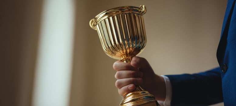 The golden trophy held proudly in a celebratory moment of achievement. photo