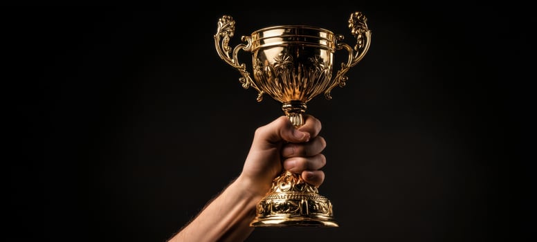 The golden trophy held high in a victorious display of achievement. photo