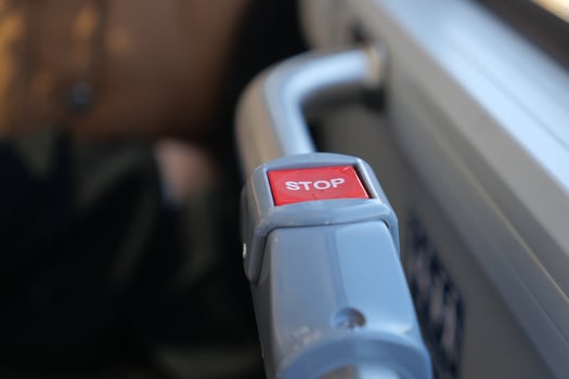 Bus stop button on public transport in urban setting photo