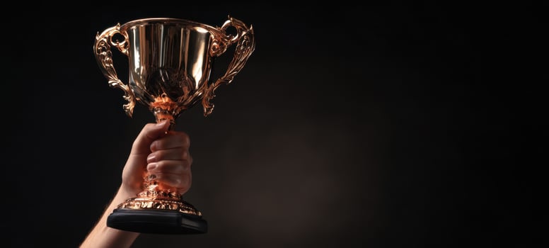 The shiny trophy held high in celebration of victory and achievement. photo