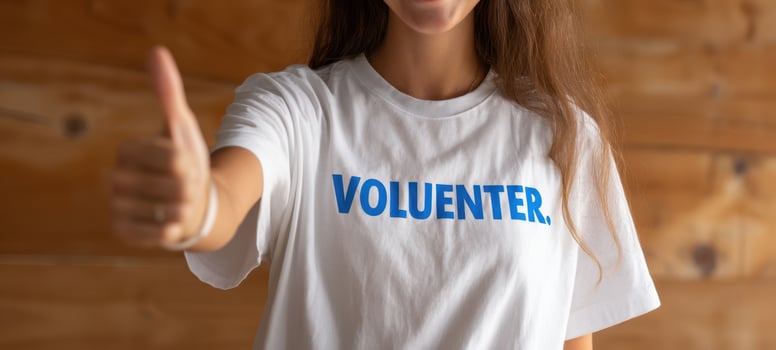 The enthusiastic volunteer giving a thumbs up in a casual setting. photo
