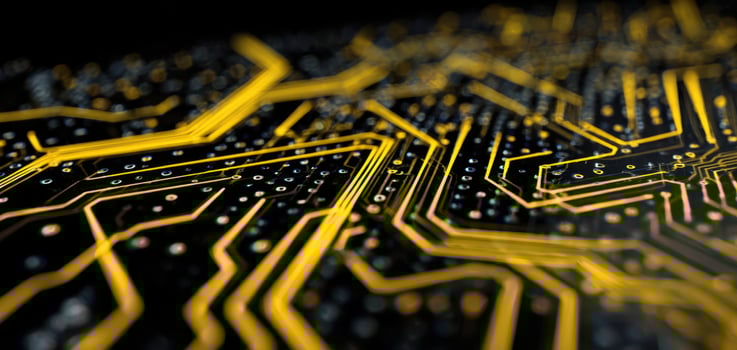The intricate design of a yellow and black electronic circuit board photo