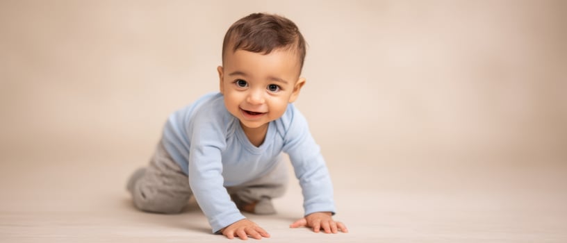 The happy baby crawling and exploring with a charming smile. photo