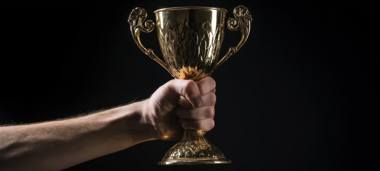 The gold trophy held high in celebration of victory and achievement. photo
