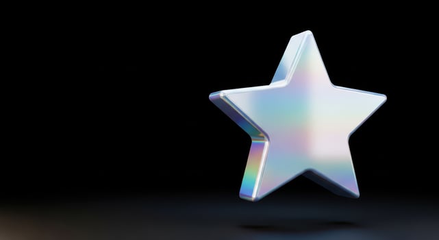 Holographic star shape with iridescent rainbow colors on black background photo