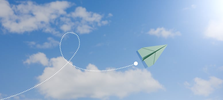 Green paper airplane flying in blue sky with dotted path, symbol of creativity, freedom, travel, and business innovation concept. 3d render. photo