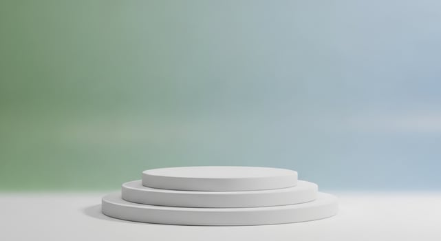 White tiered podium against soft green and blue gradient background stage platform photo
