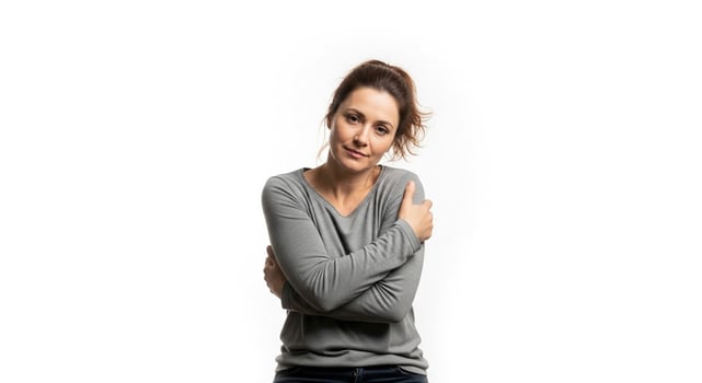 A woman is posing for a photo with her arms crossed
